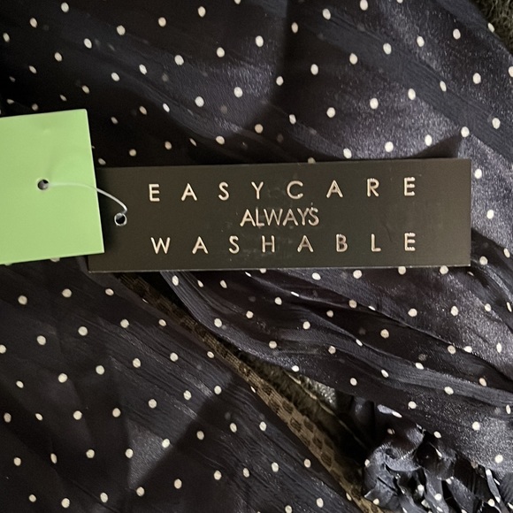 Brand NWT. Navy/ White dot tie sleeve bubble hem blouse. Brand: Sara Michelle - Picture 5 of 5